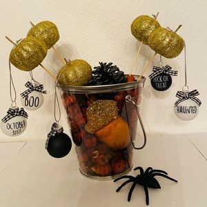 Halloween table decor with ornaments and pumpkin spice scented putka pods